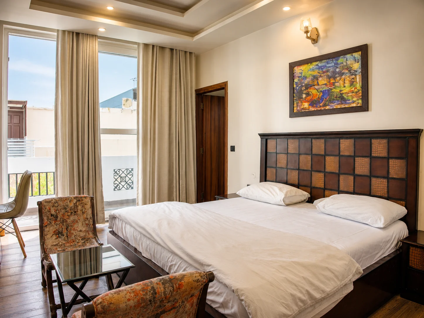 Luxury master bedroom suite with premium linen at our Dehradun homestay